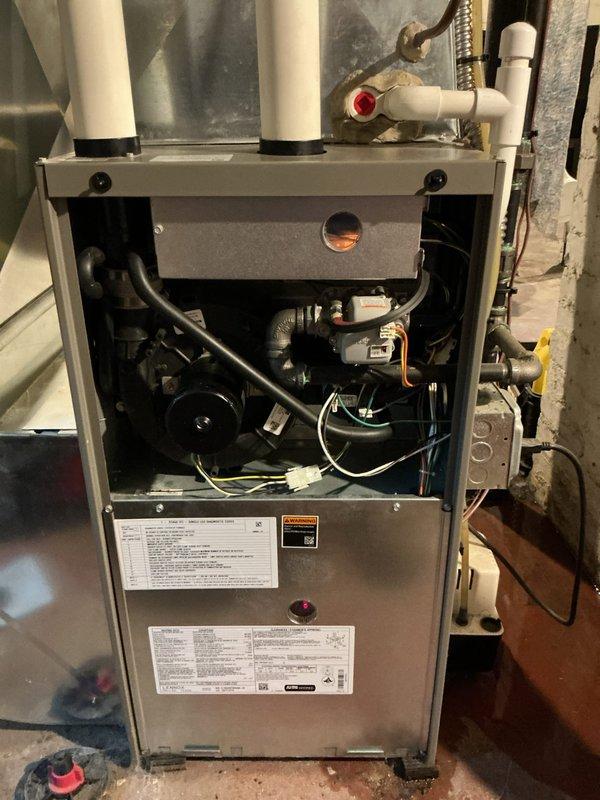 Completed comprehensive 5-year ComfortGuard maintenance service on residential HVAC system, including full inspection of gas furnace and Lennox outdoor condensing unit. Investigated reported water leak concern at furnace, inspected internal components, blower assembly, condensate drainage system, and PVC venting connections to identify source of moisture issue. Performed standard maintenance protocols on both heating and cooling equipment, verified proper system operation, and documented equipment condition with photographic records.