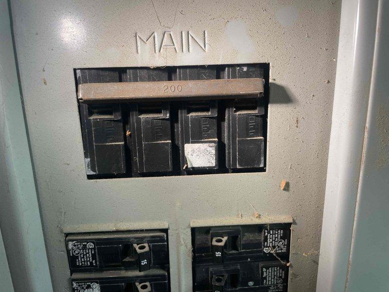 Conducted on-site evaluation for installation of Kohler 26 RCA standby generator at remodeled farmhouse with existing 200-amp main electrical service. Assessed current electrical panel configuration, exterior utility connections, and meter base location to determine optimal generator placement and transfer switch integration requirements for whole-house backup power system.