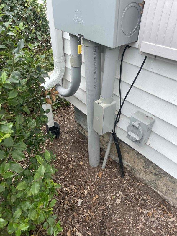 Conducted on-site evaluation for installation of Kohler 26 RCA standby generator at remodeled farmhouse with existing 200-amp main electrical service. Assessed current electrical panel configuration, exterior utility connections, and meter base location to determine optimal generator placement and transfer switch integration requirements for whole-house backup power system.
