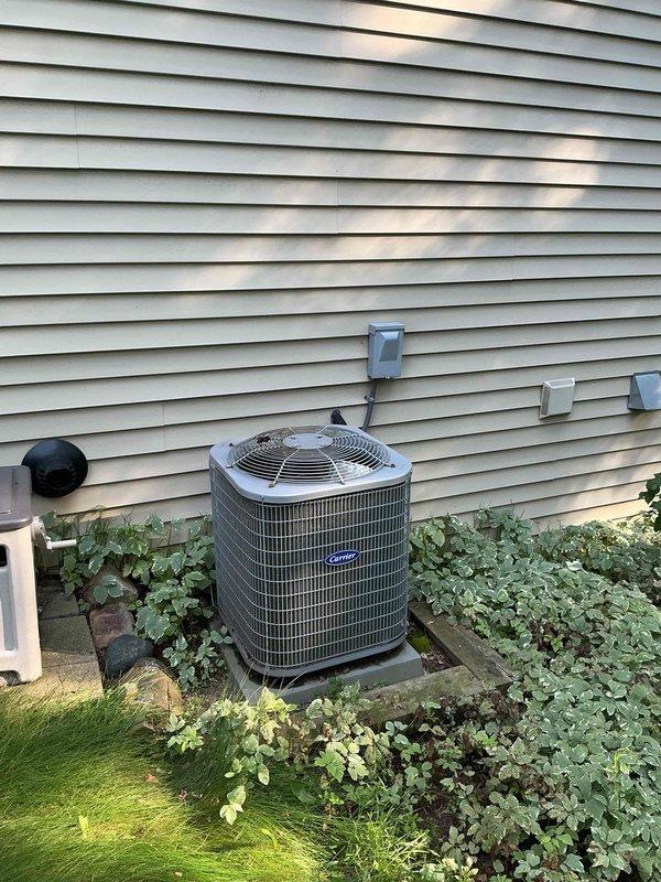 Responded to no-cool complaint on 10-year-old Carrier air conditioning system. Upon arrival, found water pooling on basement floor near furnace, traced to clogged condensate drain line from evaporator coil. System was still operating but had not received maintenance in three years. Cleared condensate blockage, restored proper drainage, and cleaned up standing water. Inspected indoor evaporator coil and outdoor condenser unit—both showed signs of neglect with debris accumulation. Performed overdue preventive maintenance including coil cleaning, filter replacement, and refrigerant pressure check. System restored to proper cooling operation with no further leaks observed.