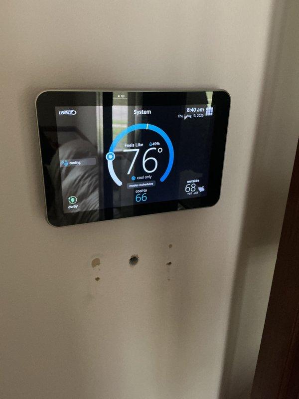 Completed annual cooling maintenance on residential HVAC system. Performed comprehensive inspection of outdoor condenser unit and verified proper operation of Lennox digital thermostat displaying 76°F ambient temperature with system set to cool mode at 66°F setpoint. All components operating within normal parameters with no service points of concern identified during this routine maintenance visit.