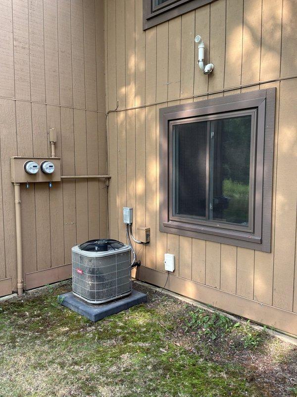 Conducted comprehensive full system estimate for 1981 two-story townhouse with basement featuring gas-fired forced air heating and central air conditioning. Evaluated existing Bryant outdoor condenser unit, indoor air handler, and complete ductwork system to address inadequate airflow to second-floor master bedroom and assess need for duct cleaning. Inspected Honeywell programmable thermostat operation, examined all refrigerant line sets, electrical connections, and disconnect box at exterior unit, and assessed overall system performance and efficiency for replacement recommendations.