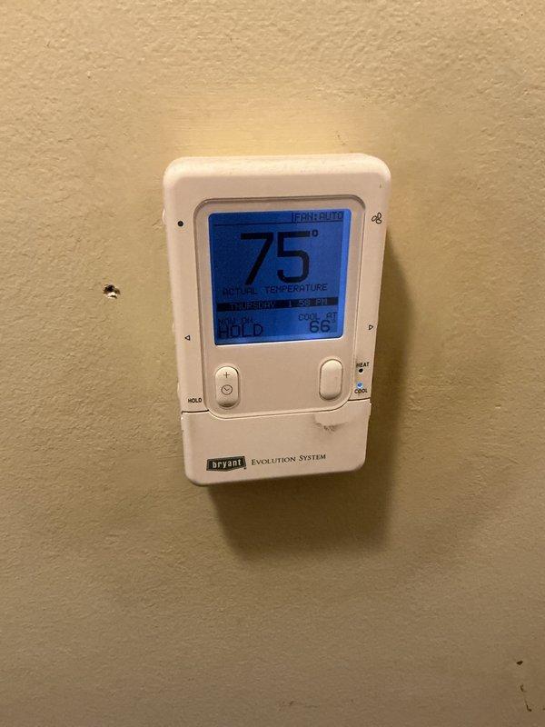 Completed routine maintenance and tune-up on 3-year-old Bryant Evolution System air conditioning unit. Performed standard cleaning procedures, inspected all components, and verified system operation. Thermostat confirmed functioning properly at 75°F with system holding set temperature. Minor mold/water staining observed near supply vent requires monitoring for potential moisture issues.