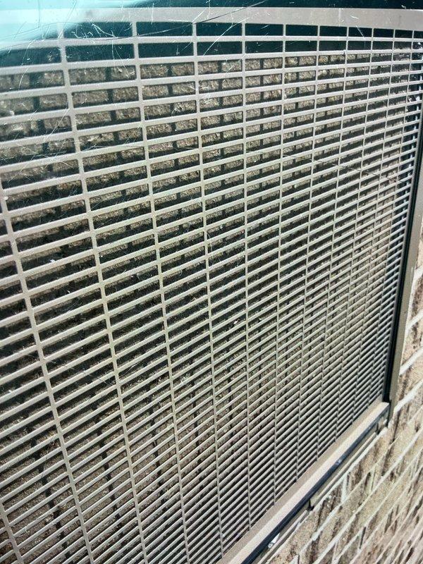 Responded to service call for non-operational A/C system with reported heating issue on 7-year-old basement unit. Upon inspection, discovered significant rust and corrosion on electrical component panel with compromised fuse holders and deteriorated wire connections, indicating moisture intrusion. Outdoor condenser unit exhibited heavily soiled coil fins with substantial dirt and debris accumulation restricting airflow. Documented electrical panel corrosion and condenser condition for recommended repairs including electrical component replacement and coil cleaning to restore proper system operation.
