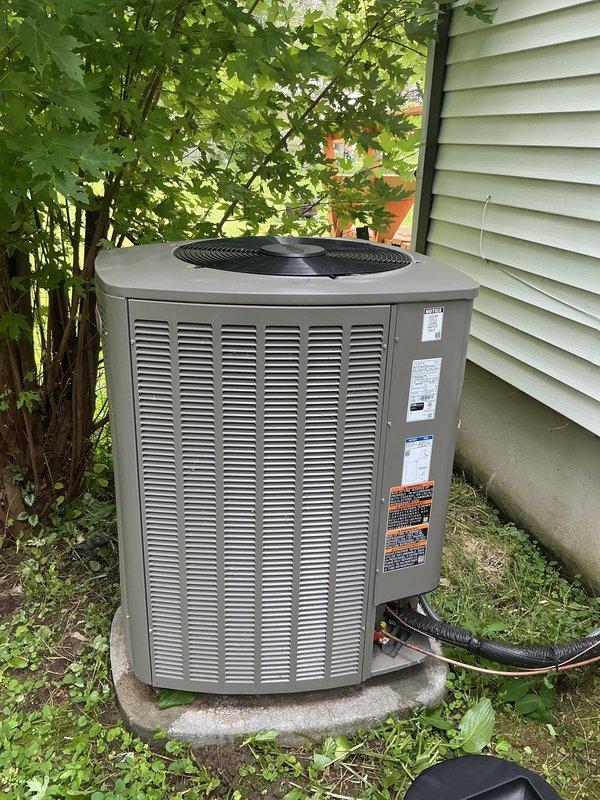 Responded to service call for newly installed 3-month-old air conditioning system unable to maintain setpoint temperature of 71°F, with house becoming excessively hot despite unit running. Performed diagnostic inspection of basement-located furnace/air handler and outdoor condenser unit. Inspected internal components including blower assembly, control boards, electrical connections, and refrigerant lines. Verified proper operation of condenser unit exterior components and checked manufacturer specifications. System covered under both parts and labor warranty. Completed troubleshooting and necessary adjustments to restore proper cooling performance and temperature regulation.