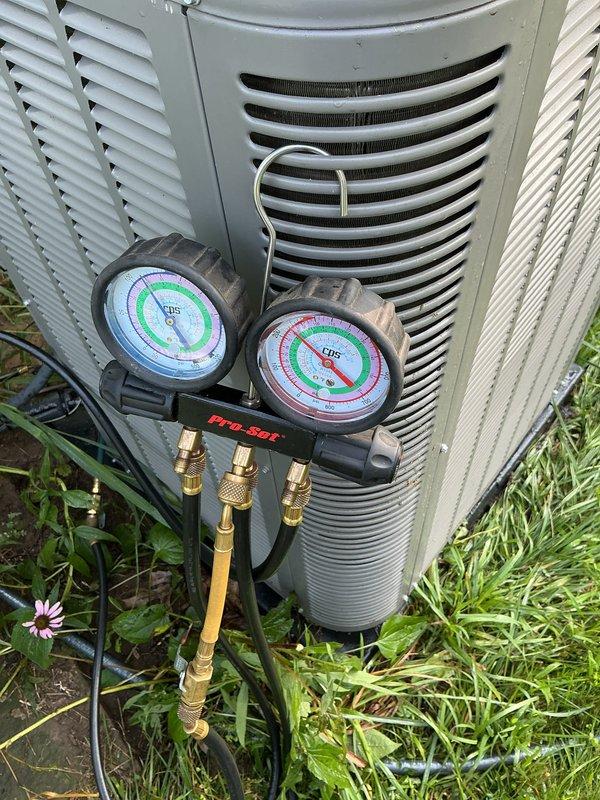 Performed scheduled air conditioning maintenance on Lennox condenser unit. Connected manifold gauges and verified refrigerant pressures and system operation. Unit required replacement of air filters and evaporator pads as noted during inspection. Completed routine ACM service checklist and documented system performance with photos for service records.