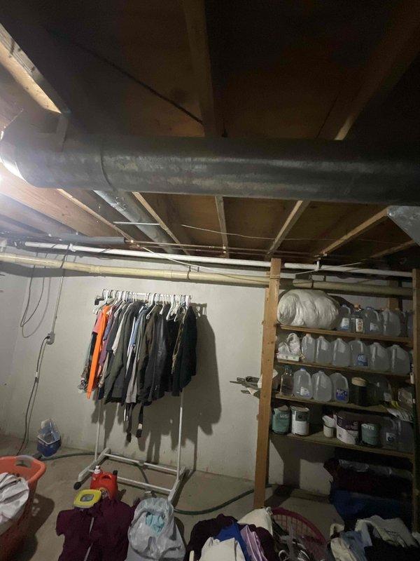 Performed site assessment for new mini-split installation in sunroom area. Evaluated basement infrastructure including existing ductwork routing, exposed joists, and available electrical pathways to determine optimal installation approach. Documented current HVAC layout and structural considerations for mini-split system versus extending existing ductwork to serve the sunroom space.