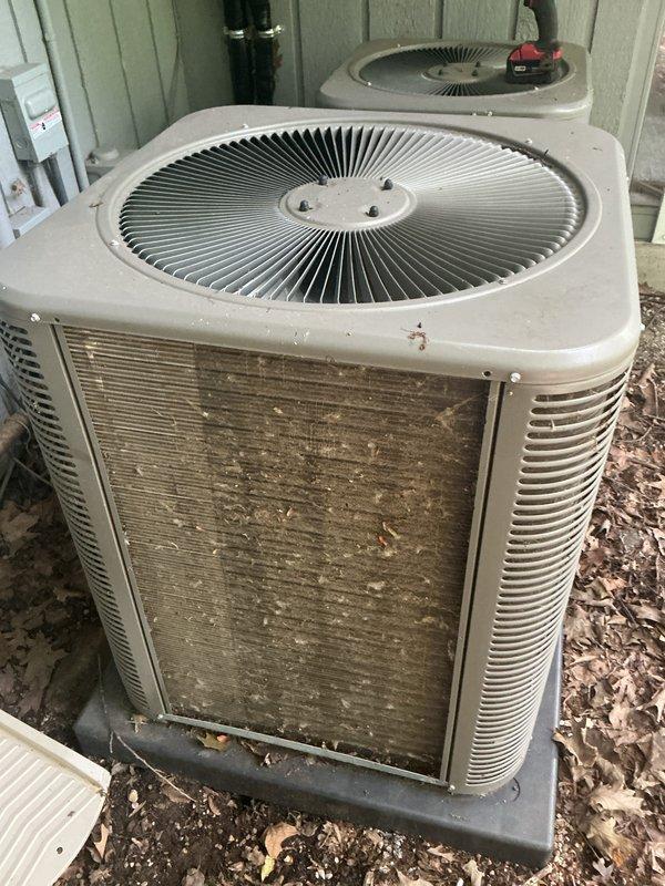 Completed annual cooling maintenance on two outdoor condensing units. Inspected both systems, documenting heavy dirt and debris accumulation on the primary unit's condenser coils and filter surfaces, while the secondary unit showed minimal buildup. Cleaned filters, checked refrigerant levels, verified electrical connections, and ensured both units were operating within normal parameters for the upcoming cooling season.