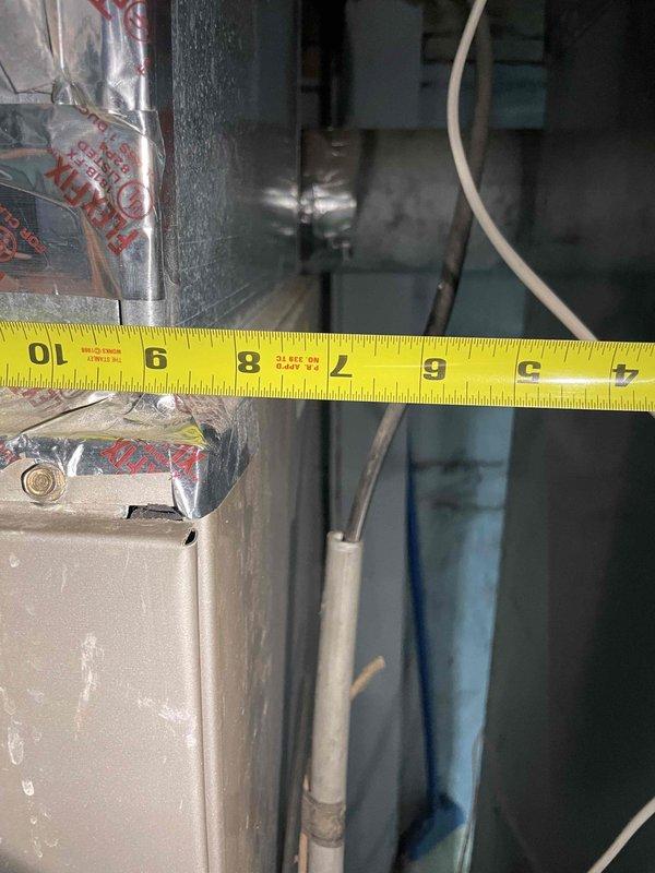 Conducted estimate for replacement of 19-year-old air conditioning and furnace system located in very small basement with limited access clearances. Both units currently operational but experiencing coil freezing issues, indicating likely refrigerant restrictions or airflow deficiencies requiring full system replacement rather than repair due to equipment age and compromised efficiency.