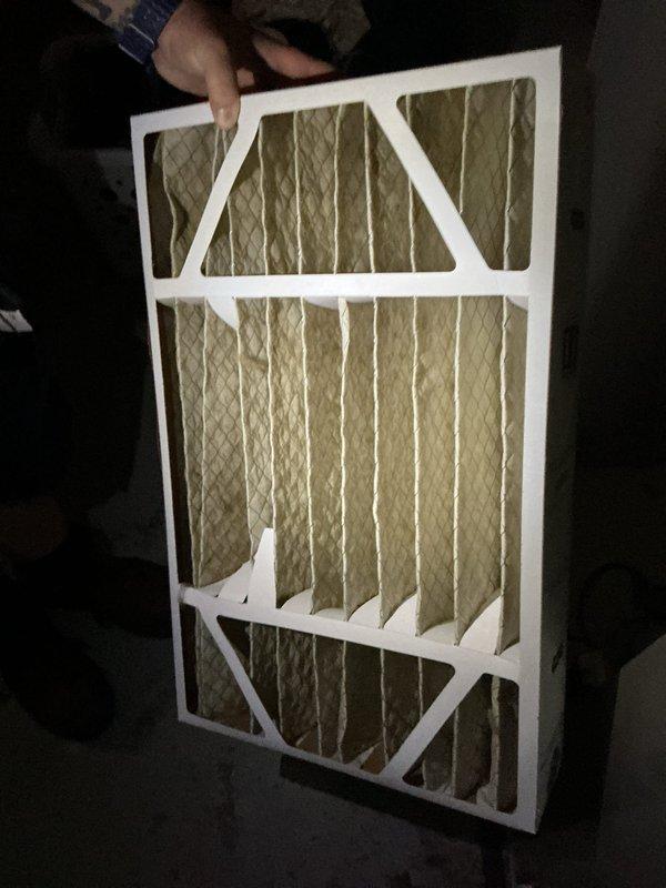 Responded to service call for air conditioning system unable to cool below 75 degrees. Upon inspection, found outdoor condensing unit with significant dirt accumulation, organic growth, and debris on exterior panels restricting airflow. Indoor air filter was heavily soiled and clogged, severely limiting system airflow and reducing cooling capacity. Cleaned condensing unit exterior surfaces, removed organic matter from panels, and replaced dirty air filter with new unit. Verified proper airflow restoration and system operation. Unit cooling effectively after service completion.