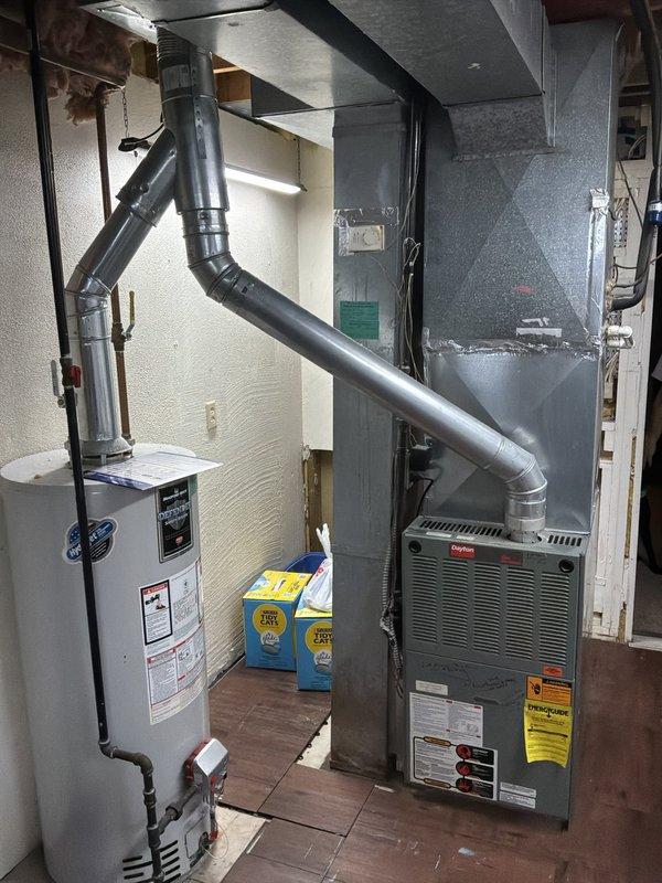 Conducted comprehensive assessment of existing HVAC system in basement mechanical room for full system replacement estimate. Evaluated current furnace unit, ductwork configuration, and water heater placement to determine optimal equipment specifications and installation requirements. Documented existing equipment conditions, spatial constraints, and necessary modifications for new system installation including proper clearances and ventilation pathways.