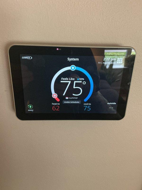 Completed annual HVAC maintenance inspection on Lennox system. Replaced air filter in return air vent, verified proper airflow direction, and confirmed thermostat operation showing system maintaining set points for heating and cooling modes.