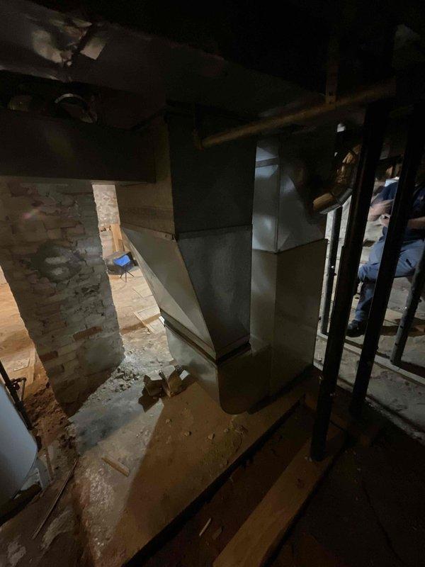 Conducted estimate for replacement of 30+ year old Amana furnace and air handler system located in basement. Current natural gas furnace remains operational but requires replacement due to age and efficiency concerns. Evaluated existing ductwork configuration and assessed installation requirements for new equipment in basement location with concrete floor and exposed foundation walls.