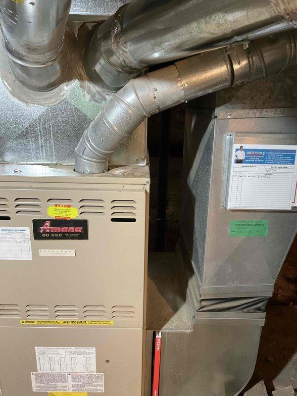 Conducted estimate for replacement of 30+ year old Amana furnace and air handler system located in basement. Current natural gas furnace remains operational but requires replacement due to age and efficiency concerns. Evaluated existing ductwork configuration and assessed installation requirements for new equipment in basement location with concrete floor and exposed foundation walls.