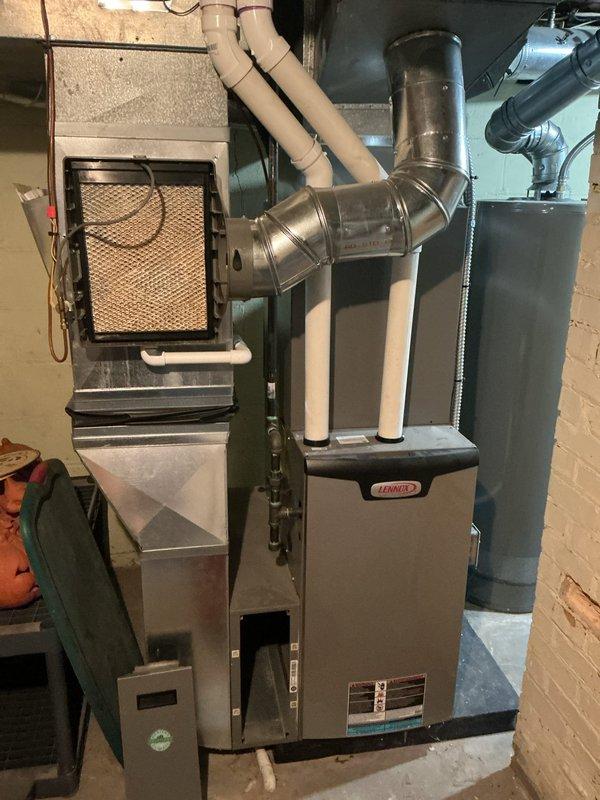 Completed scheduled maintenance tune-up on 5-year-old Lennox furnace system. Performed comprehensive inspection of all components including air filter housing, ductwork connections, and thermostat operation. System verified to be operating properly with Sensi digital thermostat maintaining proper temperature control and all mechanical components functioning within normal parameters.