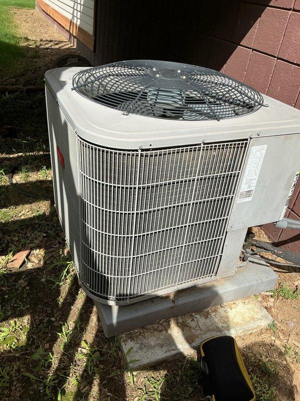 Completed annual preventive maintenance on a 10-year-old residential central air conditioning system. Performed comprehensive tune-up including inspection of outdoor condenser unit, verified proper refrigerant levels, checked electrical connections and controls, cleaned condenser coils, inspected fan motor operation, and tested system performance. Unit found operating within manufacturer specifications with no deficiencies noted. All components functioning properly with adequate airflow and cooling capacity confirmed.