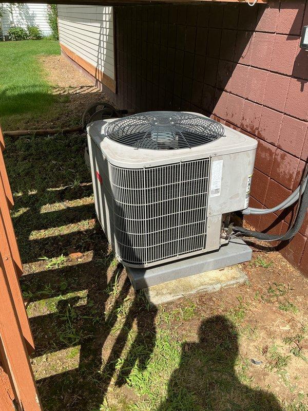 Completed annual preventive maintenance on a 10-year-old residential central air conditioning system. Performed comprehensive tune-up including inspection of outdoor condenser unit, verified proper refrigerant levels, checked electrical connections and controls, cleaned condenser coils, inspected fan motor operation, and tested system performance. Unit found operating within manufacturer specifications with no deficiencies noted. All components functioning properly with adequate airflow and cooling capacity confirmed.