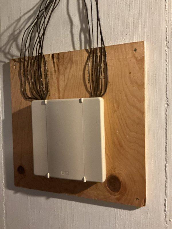 Completed annual cooling maintenance on attic-mounted air handler unit. Inspected evaporator coil access panel with expanded metal mesh filter, verified refrigerant line connections and service valves, and checked electrical control box with associated wiring. All components found in proper working order with no issues identified during routine inspection.