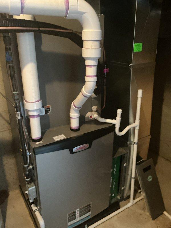 Completed scheduled air conditioning maintenance service on residential HVAC system. Performed routine inspection of indoor air handler unit and outdoor condenser unit, verified proper operation of all components, and checked refrigerant levels and electrical connections. Noted vegetation overgrowth around outdoor unit that may restrict airflow and recommended clearance for optimal system performance.