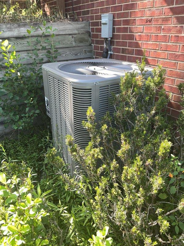 Completed scheduled air conditioning maintenance service on residential HVAC system. Performed routine inspection of indoor air handler unit and outdoor condenser unit, verified proper operation of all components, and checked refrigerant levels and electrical connections. Noted vegetation overgrowth around outdoor unit that may restrict airflow and recommended clearance for optimal system performance.