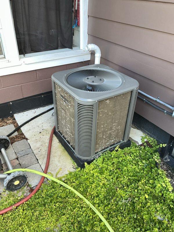 Completed annual cooling maintenance on residential AC condensing unit. Performed comprehensive system inspection, cleaned condenser coils, verified proper airflow through louvers, and documented equipment condition with photos. Unit operating within normal parameters; no repairs required at this time.
