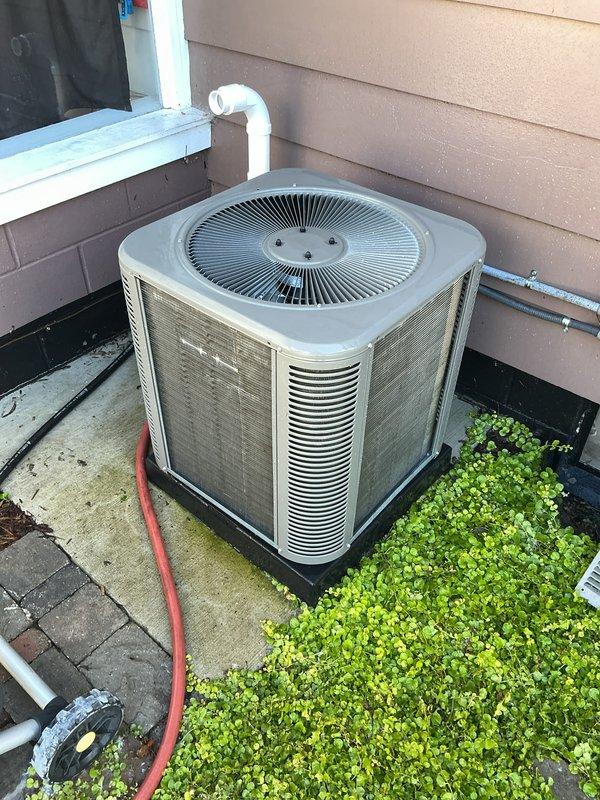 Completed annual cooling maintenance on residential AC condensing unit. Performed comprehensive system inspection, cleaned condenser coils, verified proper airflow through louvers, and documented equipment condition with photos. Unit operating within normal parameters; no repairs required at this time.