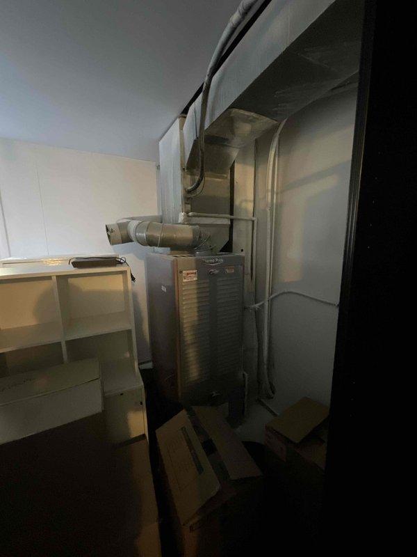 Conducted on-site evaluation for whole-house HVAC system replacement, specifically assessing 19-year-old air conditioning unit and existing oil-fired heating system. Upon inspection of basement mechanical room, determined that requested air conditioning replacement could not proceed due to incompatibility between proposed 454B refrigerant system and existing oil furnace configuration. Documented current equipment setup including metallic air handler with overhead ductwork connections, oil furnace with associated silver-gray insulated ductwork, and supporting mechanical infrastructure. Customer declined heating system replacement at this time, opting to pursue air conditioning upgrade only, which cannot be completed without addressing furnace compatibility issues.
