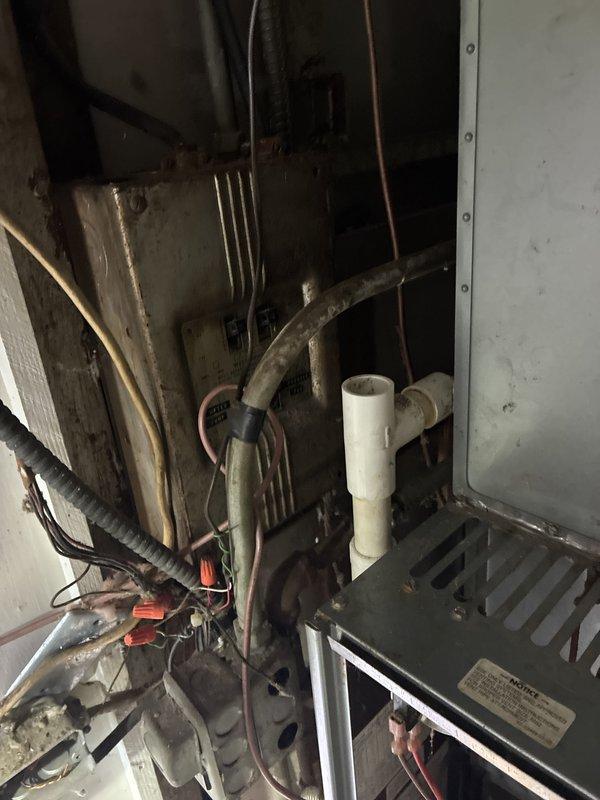Conducted comprehensive estimate for complete HVAC system replacement at 28-year-old ranch-style home with forced air natural gas heating and air conditioning. Assessed existing furnace and AC unit located in closet installation, documented current system configuration including ductwork, refrigerant lines, electrical connections, and return air plenum with X-pattern damper assembly, and provided recommendations for full system upgrade to improve efficiency and reliability.