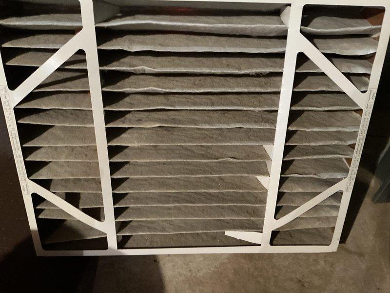 Completed annual HVAC maintenance on first of two systems, replacing air filter and humidifier pad per seasonal maintenance protocol. Verified thermostat operation showing proper heating mode function with accurate temperature display and setpoint control. System operating within normal parameters at time of service.