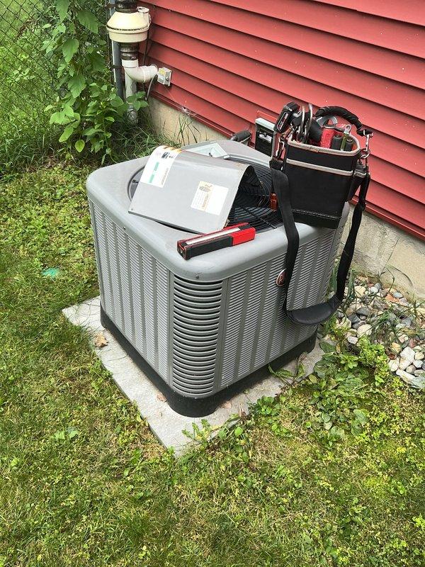 Responded to no cooling complaint on 10-year-old residential air conditioning system. Upon arrival, confirmed unit was not operating and homeowner reported complete loss of cooling function. Performed comprehensive diagnostic evaluation of both outdoor condensing unit and indoor air handler. Connected refrigerant gauges and testing equipment to assess system pressures and operational status. Inspected electrical components, refrigerant lines, condensate drainage system, and all mechanical connections at both indoor and outdoor units. Evaluated thermostat communication and power supply to equipment. Documented equipment condition with photographs showing outdoor condenser unit on concrete pad with proper clearances and indoor air handler installation in basement utility area. System components appeared well-maintained for age with copper refrigerant lines and standard ductwork configuration visible. Completed thorough assessment to identify root cause of cooling failure and provided rec