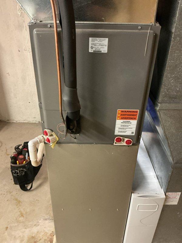Responded to no cooling complaint on 10-year-old residential air conditioning system. Upon arrival, confirmed unit was not operating and homeowner reported complete loss of cooling function. Performed comprehensive diagnostic evaluation of both outdoor condensing unit and indoor air handler. Connected refrigerant gauges and testing equipment to assess system pressures and operational status. Inspected electrical components, refrigerant lines, condensate drainage system, and all mechanical connections at both indoor and outdoor units. Evaluated thermostat communication and power supply to equipment. Documented equipment condition with photographs showing outdoor condenser unit on concrete pad with proper clearances and indoor air handler installation in basement utility area. System components appeared well-maintained for age with copper refrigerant lines and standard ductwork configuration visible. Completed thorough assessment to identify root cause of cooling failure and provided rec