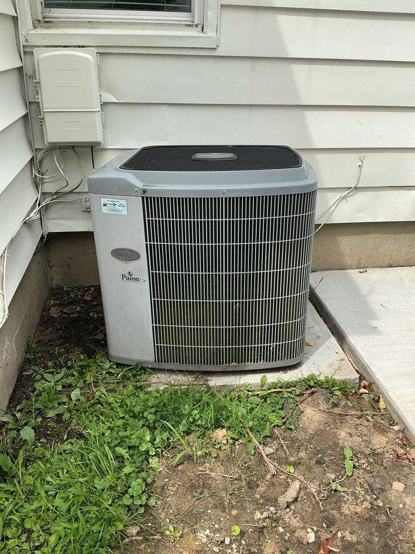 Performed scheduled maintenance on Carrier air conditioning system. Completed routine ACM service including filter replacement and evaporator pad change-out. System tested and operating within normal parameters with Emerson programmable thermostat maintaining proper temperature control.