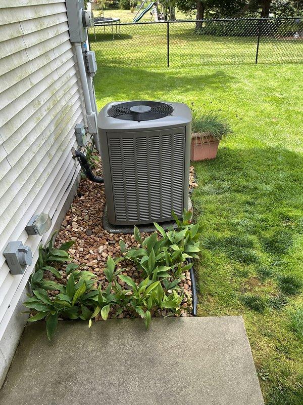 Completed annual maintenance inspection and tune-up on residential furnace and air conditioning system, both approximately two years old and functioning properly. Performed comprehensive evaluation of indoor unit components including gas valve assembly, electrical connections, and motor assembly, confirming all wiring harnesses and safety controls were secure and operational. Inspected outdoor condensing unit positioned on concrete pad, verified proper clearances from landscaping, checked refrigerant levels, and confirmed fan operation and airflow through louvers were within manufacturer specifications.
