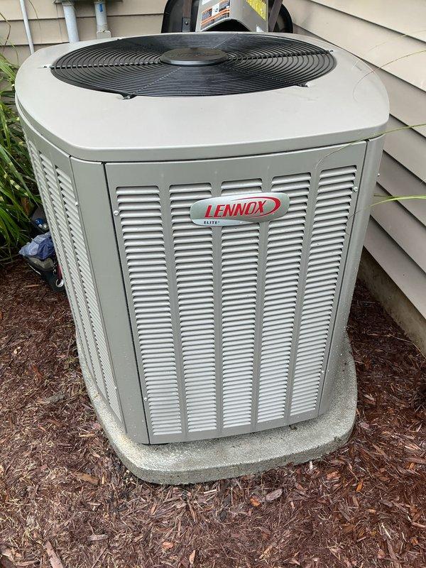 Completed complimentary air conditioning maintenance inspection on a 2-year-old Lennox Elite residential cooling system. Unit is operating within normal parameters with no reported issues or concerns. Performed standard preventive maintenance tune-up procedures including visual inspection of outdoor condenser unit, verification of proper airflow through louvered cabinet, assessment of installation integrity on concrete pad, and confirmation of adequate clearance from structure and landscaping. System shows excellent condition consistent with age, with clean exterior surfaces and well-maintained surrounding area. All components functioning properly at time of service.
