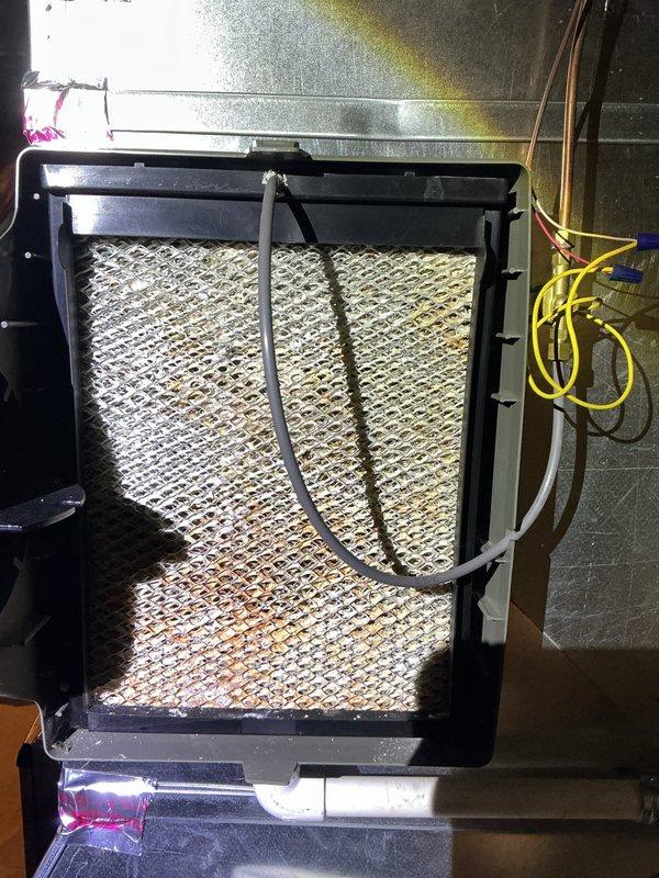 Completed comprehensive ComfortGuard Maintenance visit including replacement of air filters and evaporator pads as part of the 5-year recurring service program. Verified proper operation of Lennox smart thermostat system showing heating mode functionality with accurate temperature readings and scheduling features. All HVAC system components inspected and confirmed operational within normal parameters.