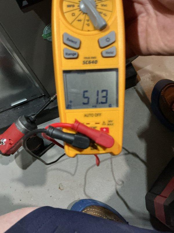 Completed annual heating and cooling maintenance on residential HVAC system. Performed electrical diagnostics using multimeter, recording voltage readings of 513V on system components. Identified and documented filter replacement requirement for HCF16-11 MERV 11 filter. Inspected furnace unit with all internal components including control boards, wiring, and mechanical systems. Verified proper operation of PVC intake and exhaust venting, copper refrigerant lines, and flexible ductwork connections. All safety labels and manufacturer specifications documented and visible on equipment.