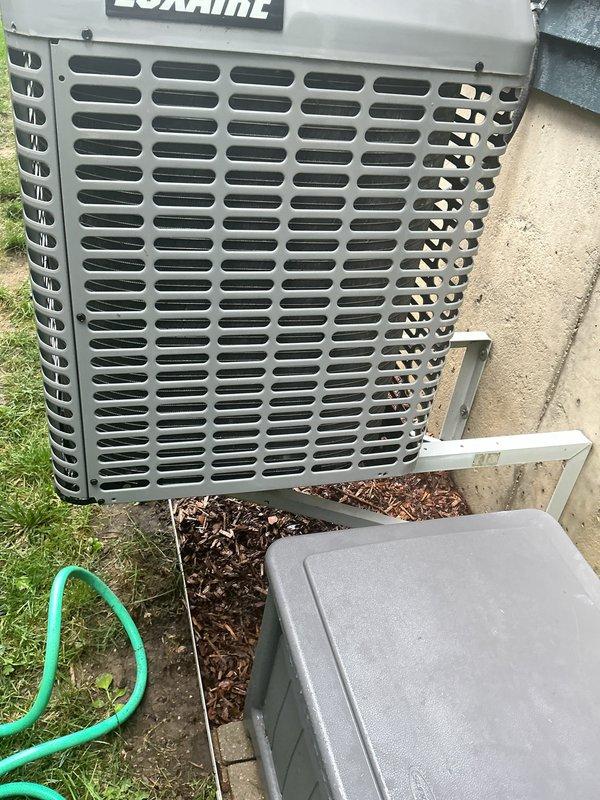 Completed routine preventative maintenance on a 7-year-old Luxaire air conditioning system. Performed comprehensive tune-up including system inspection, cleaning of outdoor condenser unit which had accumulated organic debris and mulch around the base and underneath, and replaced 16x25x4 air filter. All components inspected and found to be operating within normal parameters. System tested and confirmed proper operation upon completion of maintenance service.