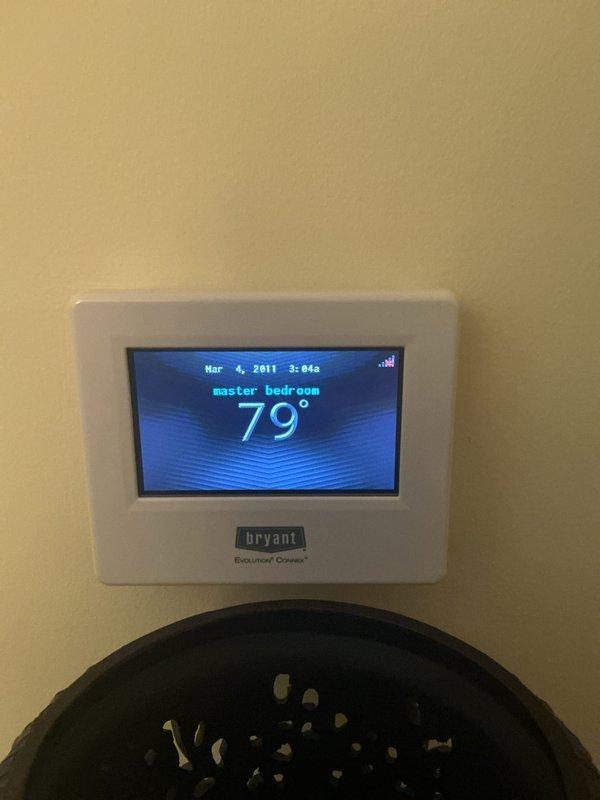 Completed annual maintenance on a 10-year-old Bryant Evolution Connex central air conditioning system. Performed comprehensive tune-up including inspection of outdoor condenser unit, verification of refrigerant lines and service valves, and confirmed proper operation of digital thermostat. System found operating within normal parameters with no deficiencies noted.