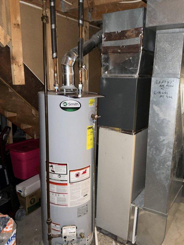 Conducted full system evaluation for residential HVAC replacement. Assessed 16-year-old furnace and 10-year-old air conditioning system currently experiencing operational failure. Documented existing equipment configuration in basement mechanical room including vertical furnace unit with ductwork connections and outdoor condensing unit mounted on exterior wall. Photographed current system specifications, nameplate data, and installation conditions to provide comprehensive replacement estimate. Customer requires expedited replacement within the next couple weeks due to non-functional cooling system.
