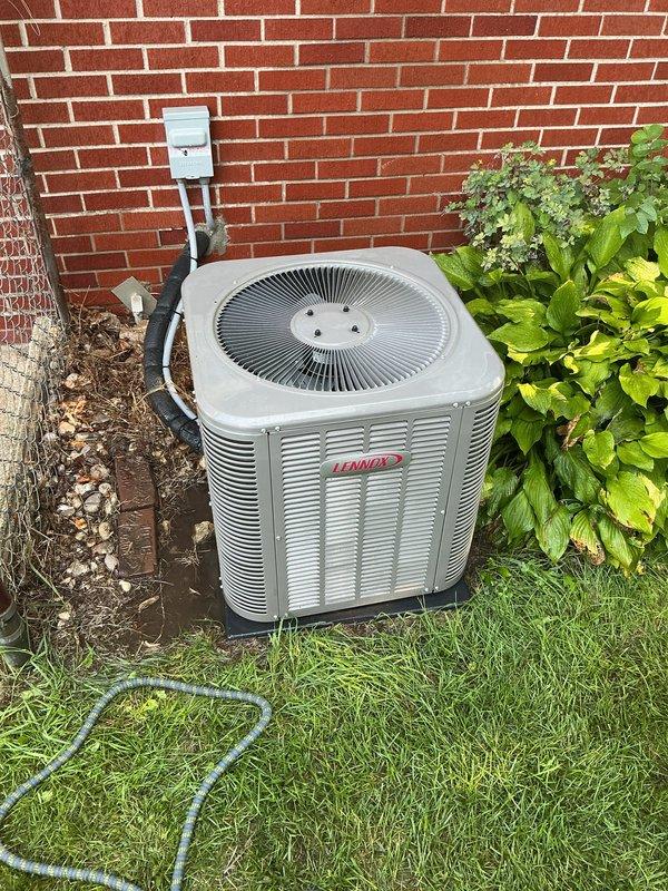 Completed annual cooling maintenance on Lennox outdoor condensing unit. Performed comprehensive system inspection including electrical disconnect verification, condenser coil examination, and operational assessment. Unit found in proper working condition with adequate clearances from surrounding landscaping and brick foundation wall.