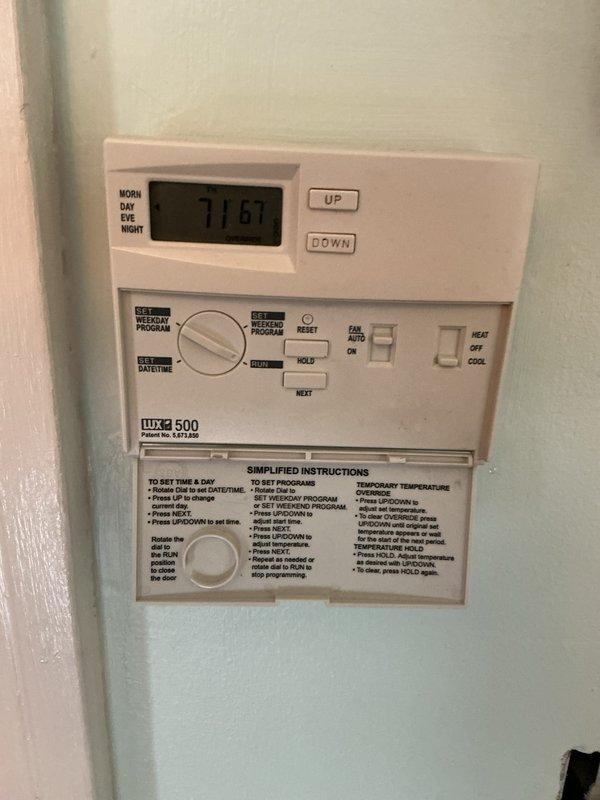Completed annual cooling maintenance inspection on HVAC system. Inspected and photographed air filter condition, confirming proper pleated media installation with X-shaped reinforcement structure. Verified thermostat operation on Lux 500 programmable model, displaying proper functionality at 67°F setpoint with all programming features and mode controls operational. System components inspected and found to be in satisfactory working condition for continued seasonal operation.