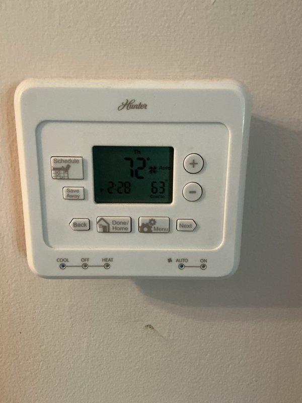 Completed routine maintenance on a 12-year-old residential air conditioning system with attic-mounted air handler and exterior condenser unit. Performed comprehensive tune-up inspection with no issues identified. System operating within normal parameters. Verified thermostat programming and temperature control functionality at 72 degrees. Inspected outdoor condenser unit including fan guard, coil grille protection, and mounting platform condition. All components found in satisfactory working order with no immediate service needs. System maintenance current through 2026.