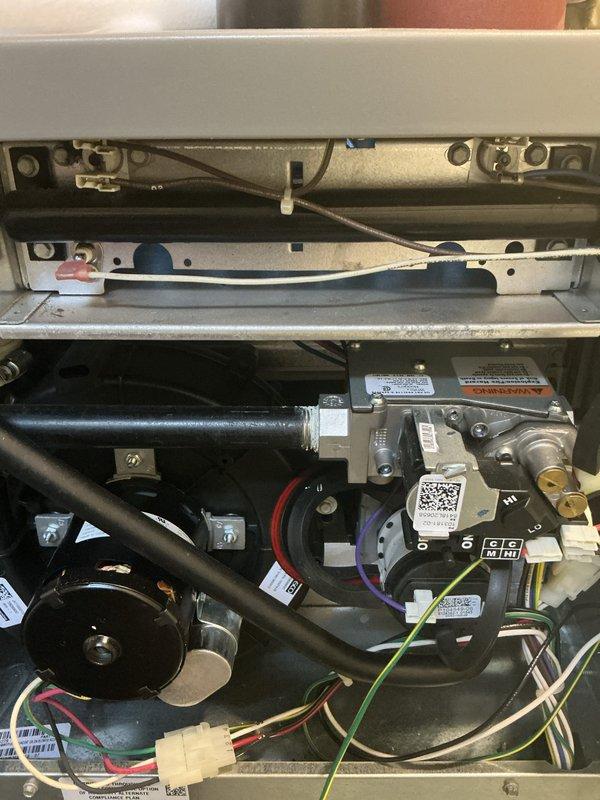 Completed routine maintenance and AC tune-up on a 6-year-old forced air furnace and air conditioning system. Inspected internal components including gas valve assembly, blower motor, electrical connections, and control wiring; all components found to be in proper working order. Verified Lennox thermostat operation and system settings, confirmed both heating and cooling systems functioning correctly with no issues identified.