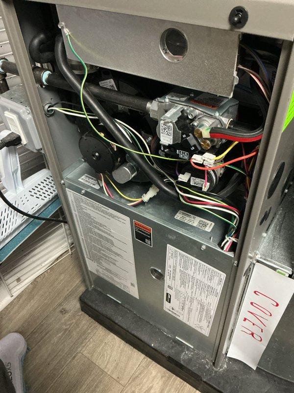Responded to callback for ComfortGuard Maintenance follow-up to address concerns from previous visit. Accessed furnace cabinet in basement and replaced severely damaged and overloaded air filter that had been left shredded. Reinstalled access panel cover that had been left off during prior service visit. Performed complete furnace inspection including verification of all electrical connections, motor assembly, capacitors, and control boards. Inspected wiring harnesses, ground connections, and safety controls throughout the unit. Confirmed proper operation of all mechanical and electrical components. Addressed thermostat alert issues reported by homeowner. System now operating within normal parameters with all access panels properly secured and new filter installed.