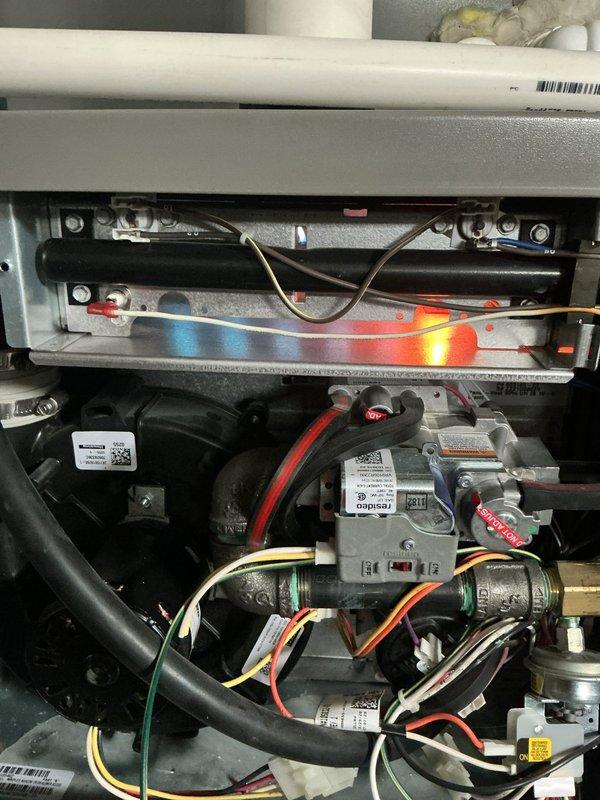 Completed comprehensive ComfortGuard Maintenance service on Lennox HVAC system, including filter and evaporator pad replacement as requested. Performed full system inspection with burner operation verified showing proper blue flame with orange accents, confirming optimal combustion efficiency. Thermostat functionality tested and confirmed operating correctly in cooling mode with accurate temperature readings and remote monitoring capabilities.