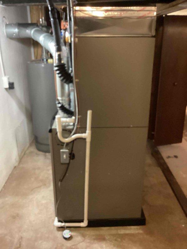 Completed full HVAC system installation including a 90,000 BTU furnace with evaporator coil and 2.5-ton air conditioning condenser unit. The furnace was installed in the basement mechanical room with proper PVC venting, while the outdoor condenser was positioned on a gravel pad with electrical conduit connection. All equipment was reconnected to existing ductwork and utility services, with mechanical permit obtained prior to installation.
