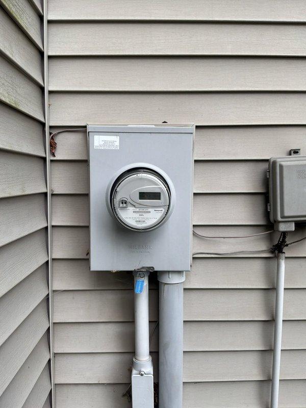 Conducted on-site evaluation for furnace and hot water tank replacement estimate at residential property. Assessed basement equipment location, confirmed natural gas fuel source, and documented existing electrical service infrastructure including meter and conduit configuration. Provided comprehensive replacement options for both heating system and domestic hot water equipment.