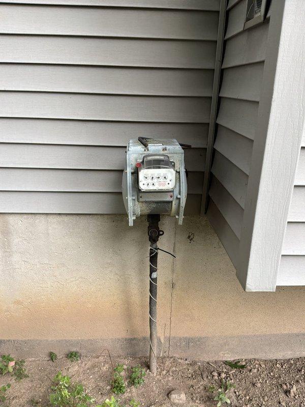 Conducted on-site evaluation for furnace and hot water tank replacement estimate at residential property. Assessed basement equipment location, confirmed natural gas fuel source, and documented existing electrical service infrastructure including meter and conduit configuration. Provided comprehensive replacement options for both heating system and domestic hot water equipment.