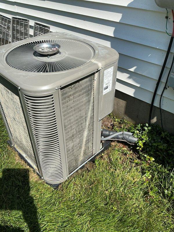Completed scheduled ComfortGuard maintenance visit for residential HVAC system. Performed comprehensive inspection of outdoor air conditioning condenser unit, which exhibited significant debris accumulation on exterior fins and louvers requiring attention. Replaced furnace air filter as part of routine preventative maintenance protocol to ensure optimal system airflow and efficiency.