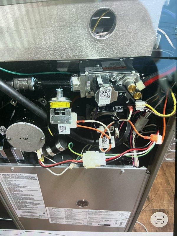 Returned to address frozen evaporator coil issue from recent furnace and 2-ton A/C installation. Previous technician found system iced over due to low refrigerant charge at startup. Added refrigerant to manufacturer specifications, verified proper system operation, and confirmed adequate airflow across coil. Also inspected and resolved condensate drainage leak from PVC piping connections. System now operating within normal parameters with no further issues detected.
